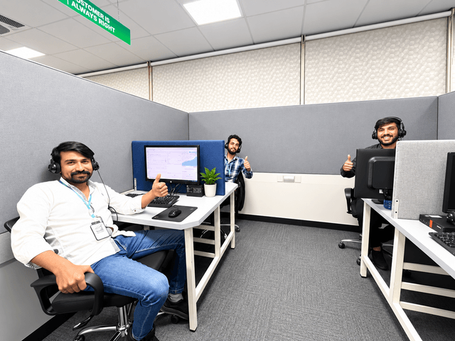 ORiON headset operators smiling at their workstations